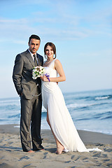 Image showing romantic beach wedding at sunset