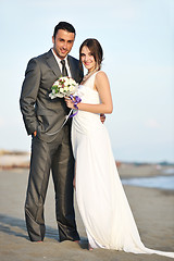 Image showing romantic beach wedding at sunset