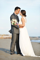 Image showing romantic beach wedding at sunset