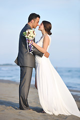 Image showing romantic beach wedding at sunset