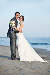 Image showing romantic beach wedding at sunset