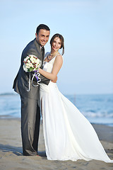 Image showing romantic beach wedding at sunset