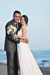 Image showing romantic beach wedding at sunset