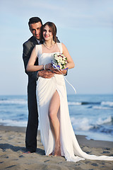 Image showing romantic beach wedding at sunset