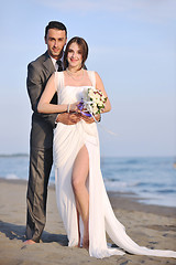 Image showing romantic beach wedding at sunset