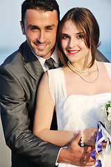 Image showing romantic beach wedding at sunset