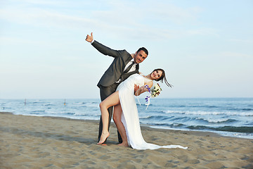 Image showing romantic beach wedding at sunset