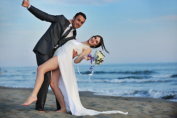 Image showing romantic beach wedding at sunset