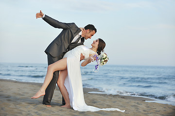 Image showing romantic beach wedding at sunset