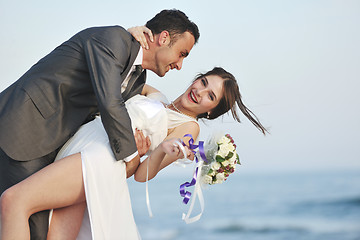 Image showing romantic beach wedding at sunset