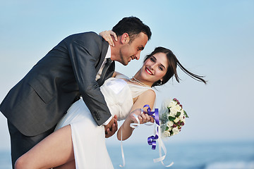 Image showing romantic beach wedding at sunset