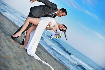 Image showing romantic beach wedding at sunset