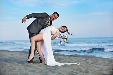 Image showing romantic beach wedding at sunset