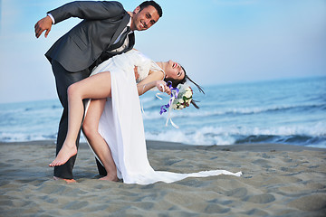 Image showing romantic beach wedding at sunset