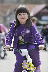 Image showing happy childrens group learning to drive bicycle