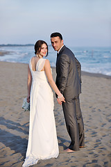 Image showing romantic beach wedding at sunset