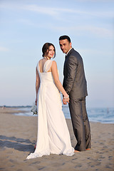 Image showing romantic beach wedding at sunset