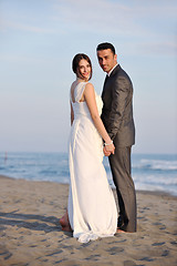 Image showing romantic beach wedding at sunset