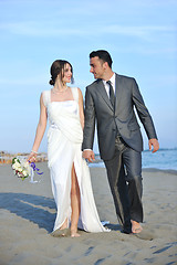 Image showing romantic beach wedding at sunset