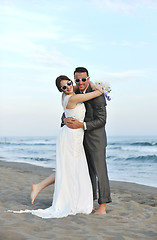 Image showing romantic beach wedding at sunset