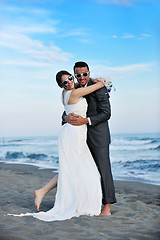 Image showing romantic beach wedding at sunset