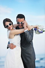 Image showing romantic beach wedding at sunset