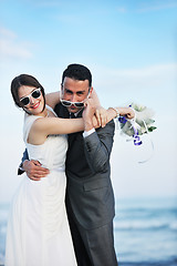 Image showing romantic beach wedding at sunset