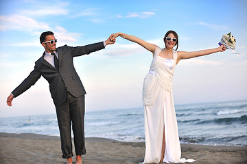 Image showing romantic beach wedding at sunset