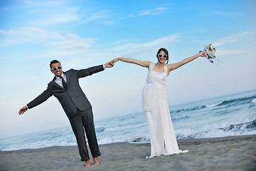 Image showing romantic beach wedding at sunset