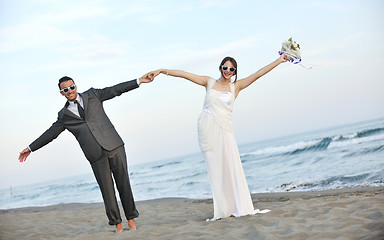 Image showing romantic beach wedding at sunset