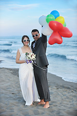 Image showing romantic beach wedding at sunset