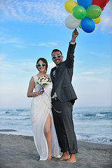 Image showing romantic beach wedding at sunset