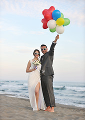 Image showing romantic beach wedding at sunset