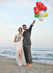 Image showing romantic beach wedding at sunset