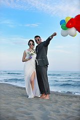 Image showing romantic beach wedding at sunset