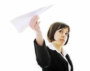 Image showing business woman throwing  paper airplane 