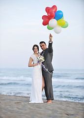 Image showing romantic beach wedding at sunset