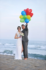 Image showing romantic beach wedding at sunset