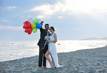 Image showing romantic beach wedding at sunset