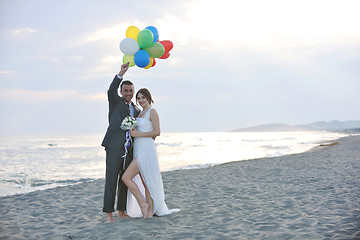 Image showing romantic beach wedding at sunset