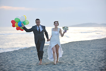 Image showing romantic beach wedding at sunset