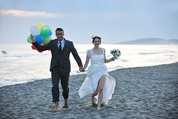 Image showing romantic beach wedding at sunset