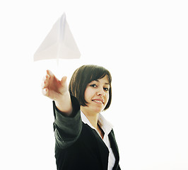 Image showing business woman throwing  paper airplane 