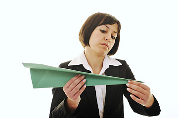 Image showing business woman throwing  paper airplane 
