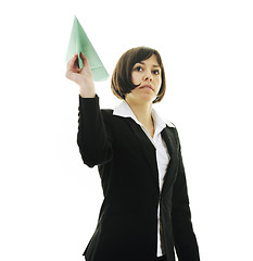 Image showing business woman throwing  paper airplane 