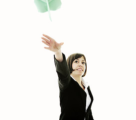 Image showing business woman throwing  paper airplane