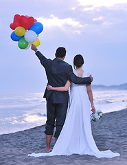 Image showing romantic beach wedding at sunset