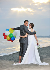 Image showing romantic beach wedding at sunset