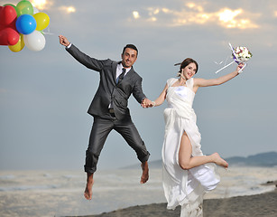 Image showing romantic beach wedding at sunset