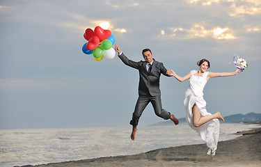 Image showing romantic beach wedding at sunset